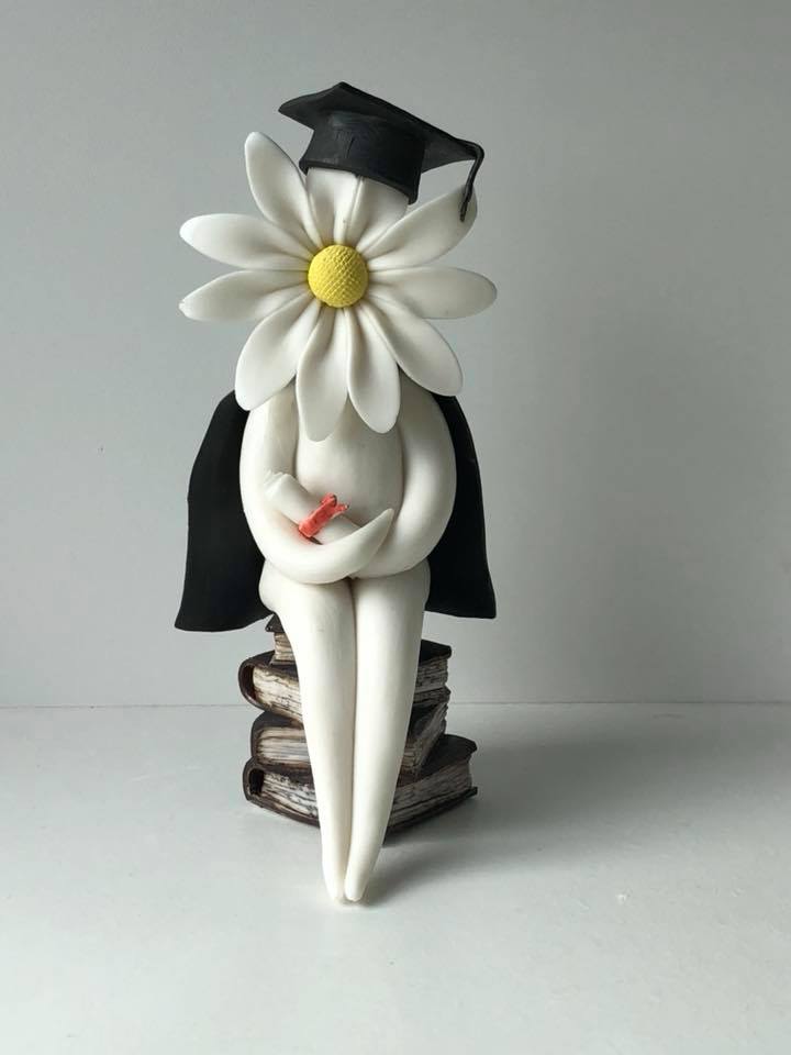 handmade daisy lady graduation-pottery flower sculpture