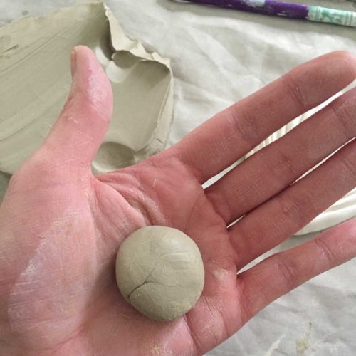 ball of clay in palm